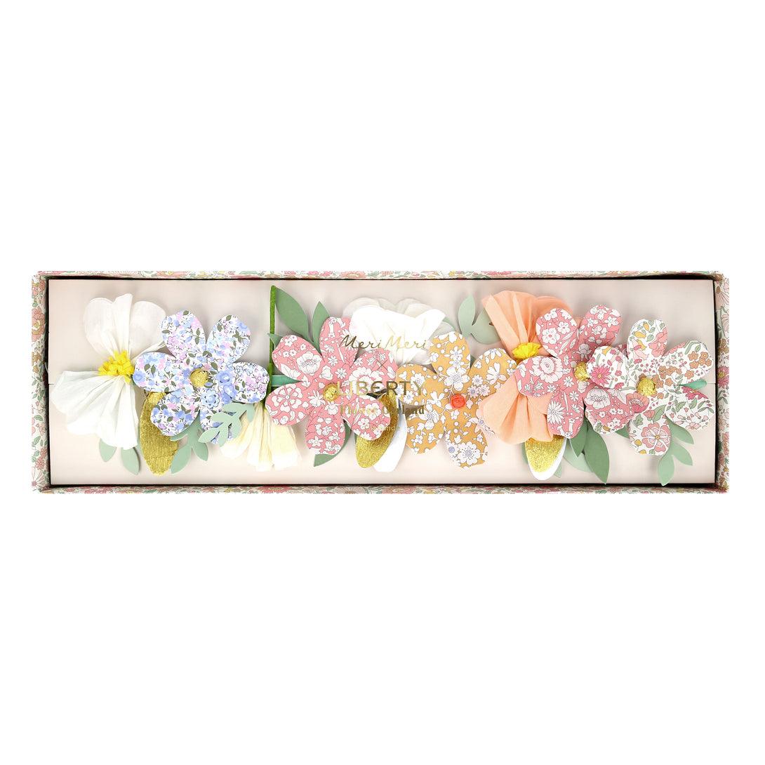 Our floral garland features pretty Liberty prints, making it wonderful for home decoration or as a baby shower decoration.