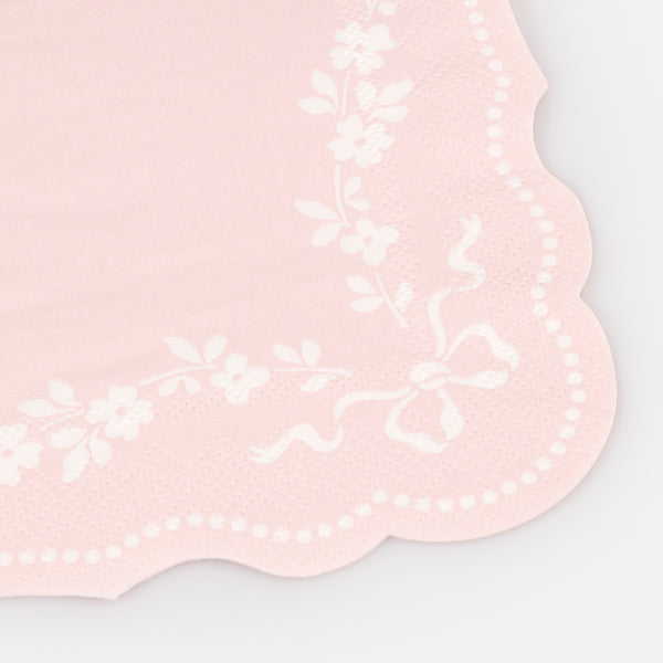 Our small paper napkins, are pastel pink with a white ornamental design and sculptured edges, perfect for bridal showers or baby showers. Image2