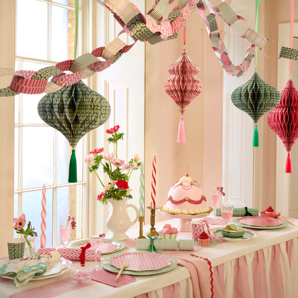 Our hanging Christmas decorations, made from honeycomb, feature stylish Molly Mahon prints designs and shimmering tinsel tassels. Image2
