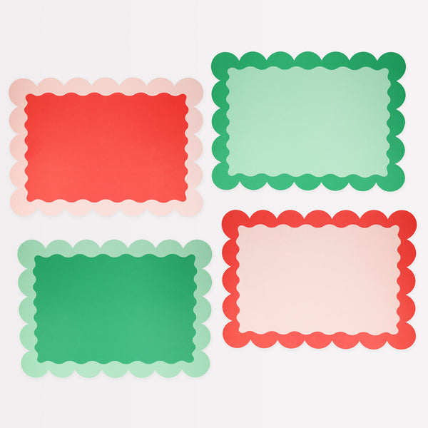 Our paper placemats are crafted in Christmas colours of red and green, with a modern pop of pink, and stylish scalloped edges.