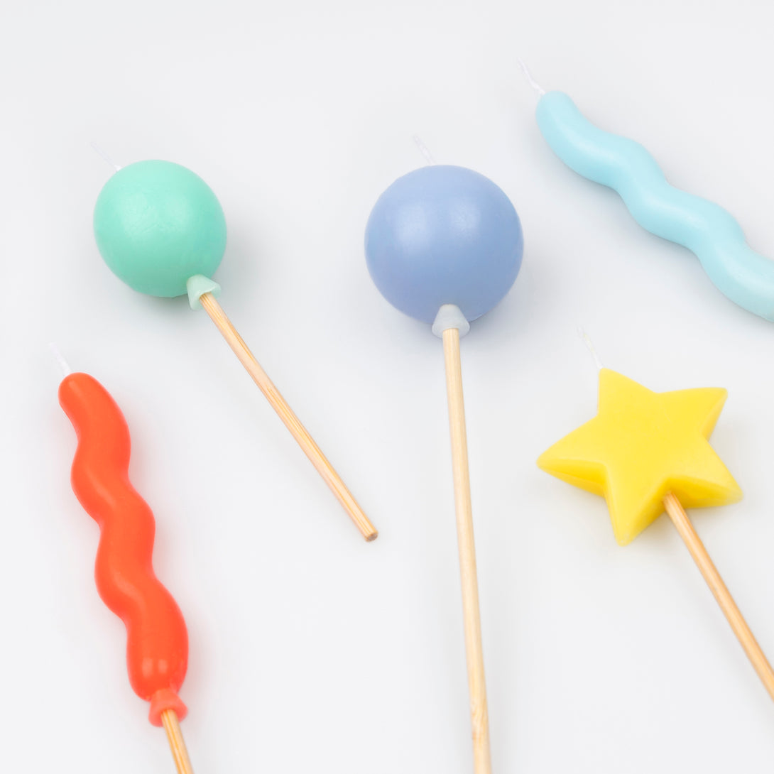 Our birthday candles are great as birthday cake decorations, featuring balloon shapes and bright colours.