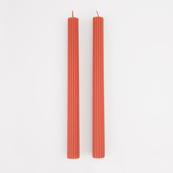 Our tall candles, in coral, are wonderful as a hostess gift or table decoration.