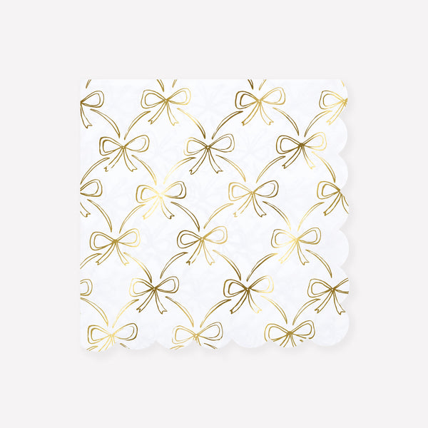 Our Christmas paper napkins have a shiny gold foil bow design to add sophistication to your festive parties. Image1