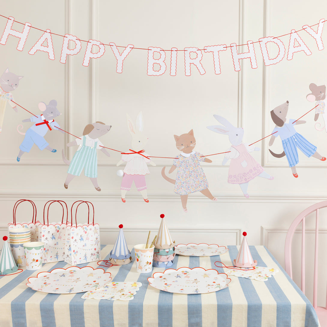 Our Animal Friends party set is ideal for first birthdays, featuring adorable tableware, party bags, party hats and a large paper garland. 