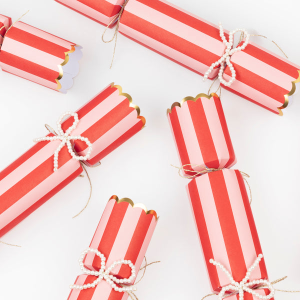 Our Christmas crackers, with bright stripes and faux pearl bow details, which can also be used as tree decorations, contain premium gifts. Image3