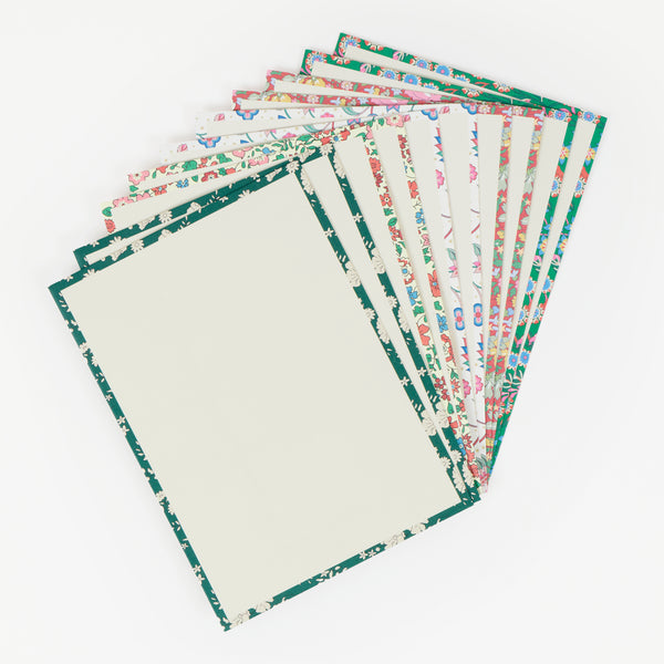 Our Christmas card set features 10 tree shaped cards with 5 different Liberty print designs, topped with velvet ribbon bows for a stylish look. Image6