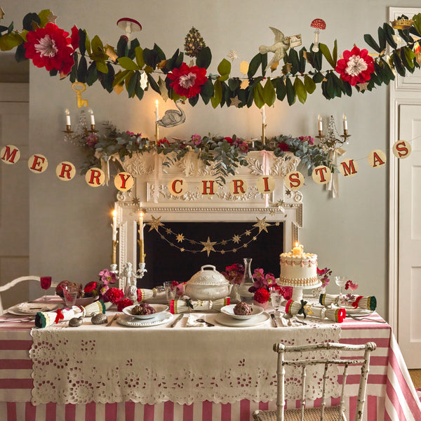 Our Christmas garlands set includes 2, one with foliage and decorative John Derian icons, the other with a Merry Christmas message. Image2
