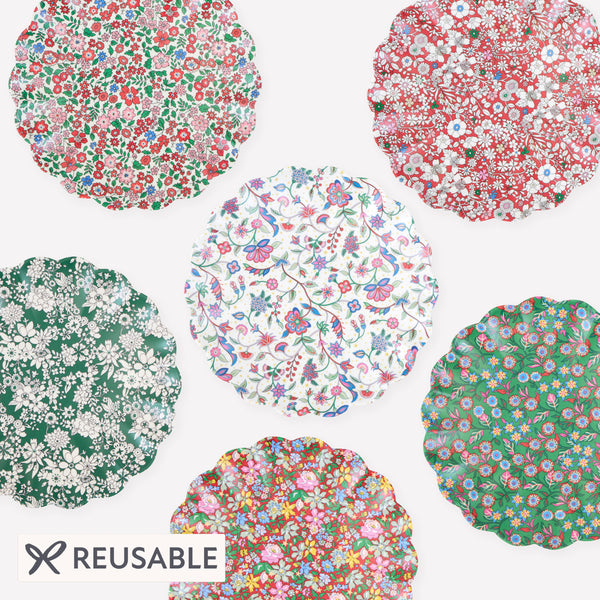 Our small Christmas melamine plates feature 8 Liberty floral print designs in red and green tones for a stylish look, year after year. Image1