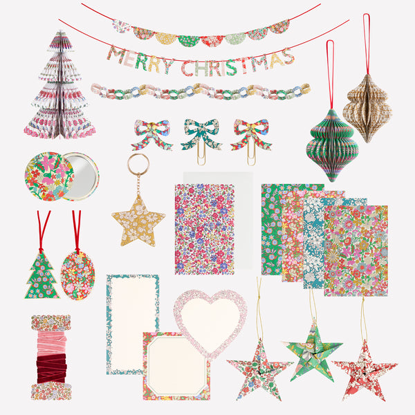 Our advent calendar is beautifully presented in a large Liberty print design box with 24 boxes inside containing stationery and decorations. Image7