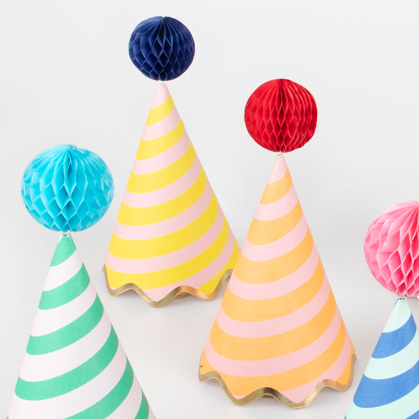 Our party accessories include hats with stripes and pompoms for a fun look. Image3