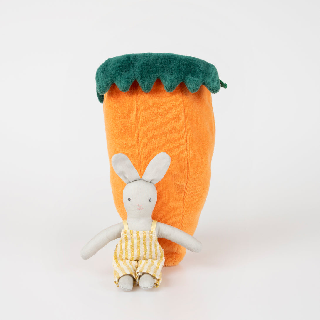 Our mini fabric bunny toy lives in a velvet carrot pouch for lots of imaginative fun.