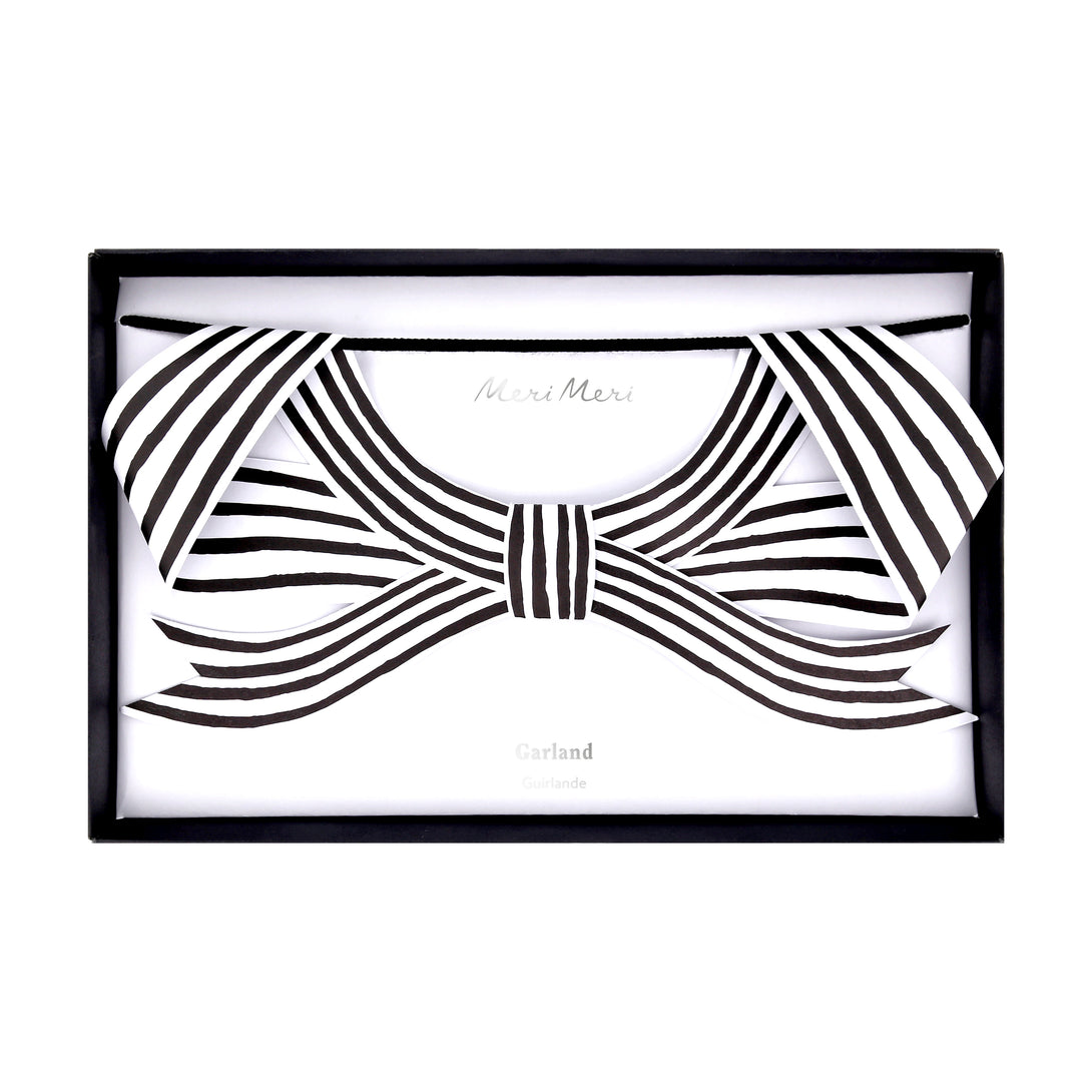 Our paper garland is perfect to add to your Halloween hanging decorations, with black and striped bows it's eerily stylish. Image5