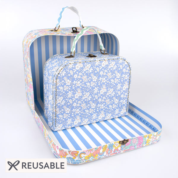 Our mini suitcases feature Liberty floral print designs and stitched card, so are sophisticated travel accessories and storage solutions. Image1