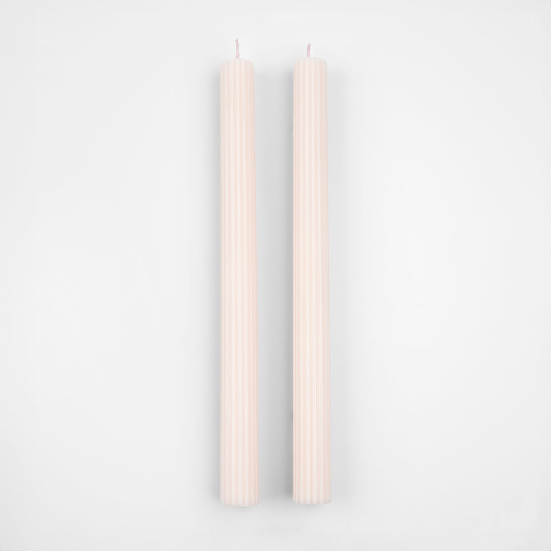 Decorate your table or mantel with our ridged long candles in a pretty peach pink shade.