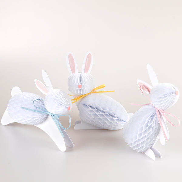 Our Easter bunny decorations, crafted with honeycomb paper and raffia ribbons, look amazing.