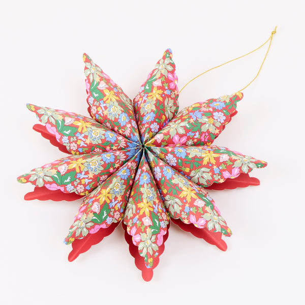 Our star decorations are designed to hang from your Christmas tree, featuring elegant Liberty print designs in rich festive colours. Image3