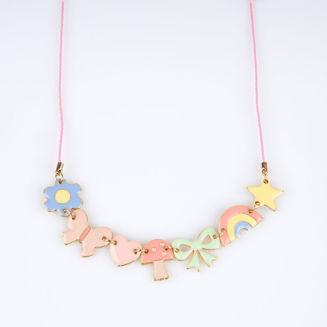 Our charms necklace is crafted with colourful enamel charms with a pink cord and gold tone lobster clasp, a pretty necklace for kids.