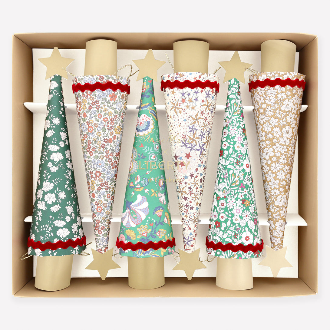 Our Christmas crackers feature stunning Liberty floral prints, velvet ric rac, matt gold tone details, and contain a party hat, joke and quality gift. Image1