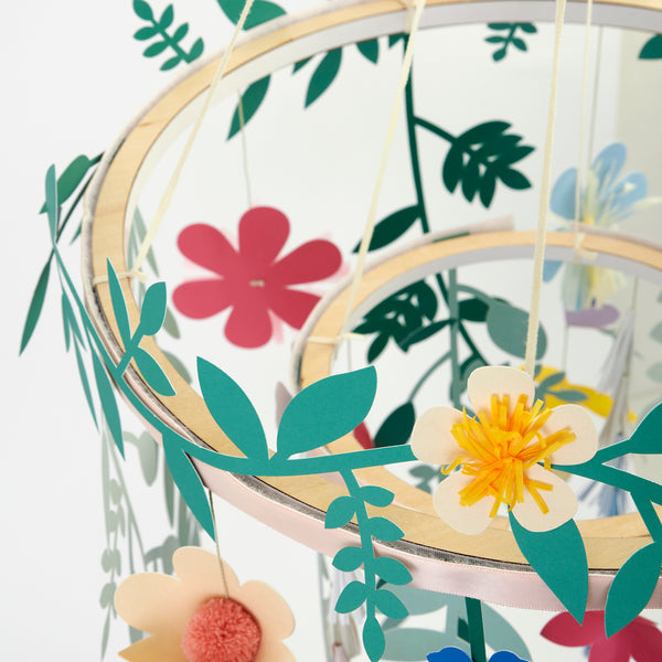 Our beautiful paper chandelier is crafted from paper flowers and leaves and wooden hoops. Image2