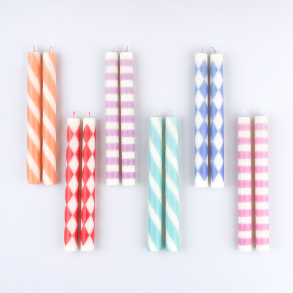 Add colour and style to a table setting with a table candle. Our set of 12, in 6 colours and designs, is a wonderful candle gift too. Image2