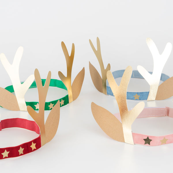 Our antler headbands, with velvet bands, shiny gold stars and antlers, and reindeer ears, make fun Christmas headwear. Image3