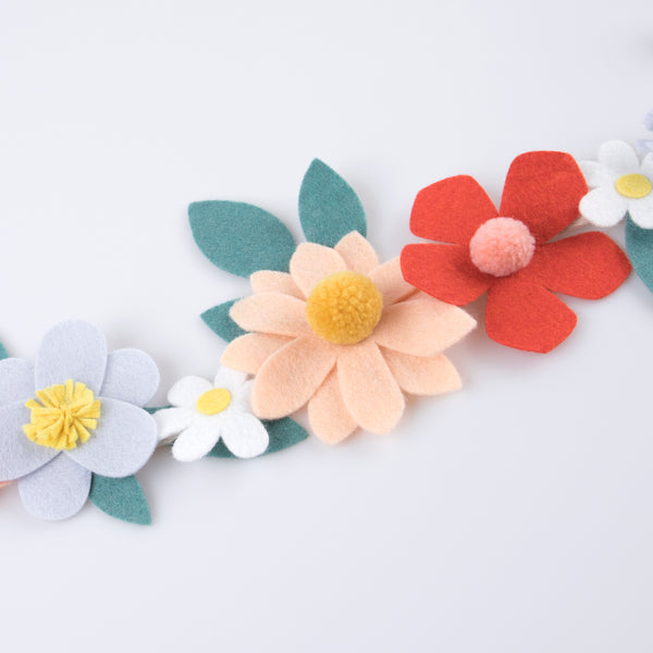 Our special party garland is crafted from felt, with flowers with pompom centres. Image3