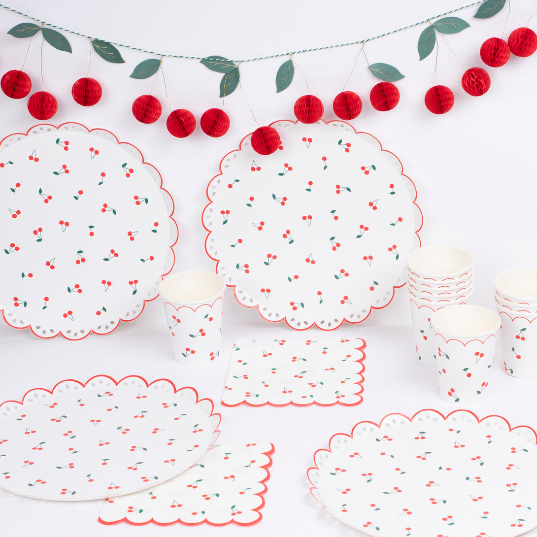 Use our special cherry party supplies for a vibrant look at your parties, our set includes paper plates, cups, napkins and a honeycomb garland. 