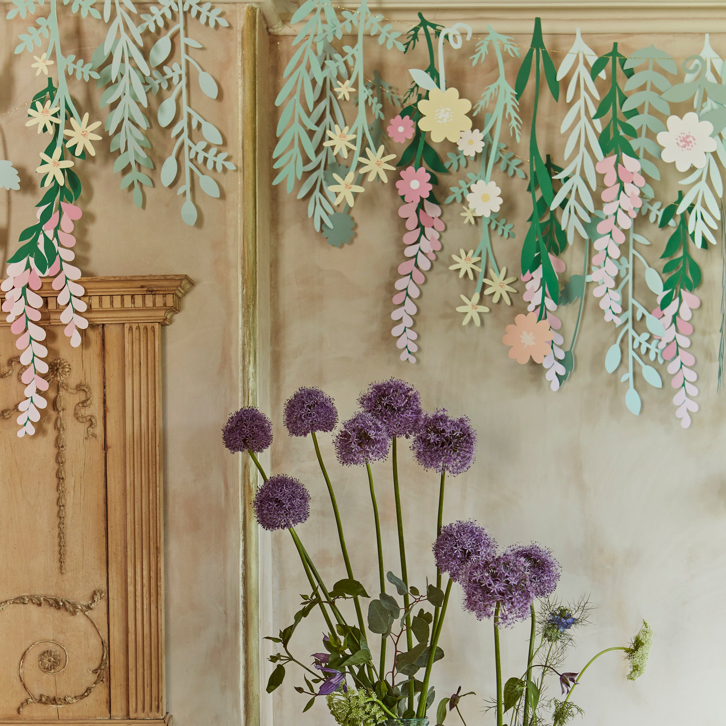 Our party garland, with flowers and foliage, is the perfect party packdrop.
