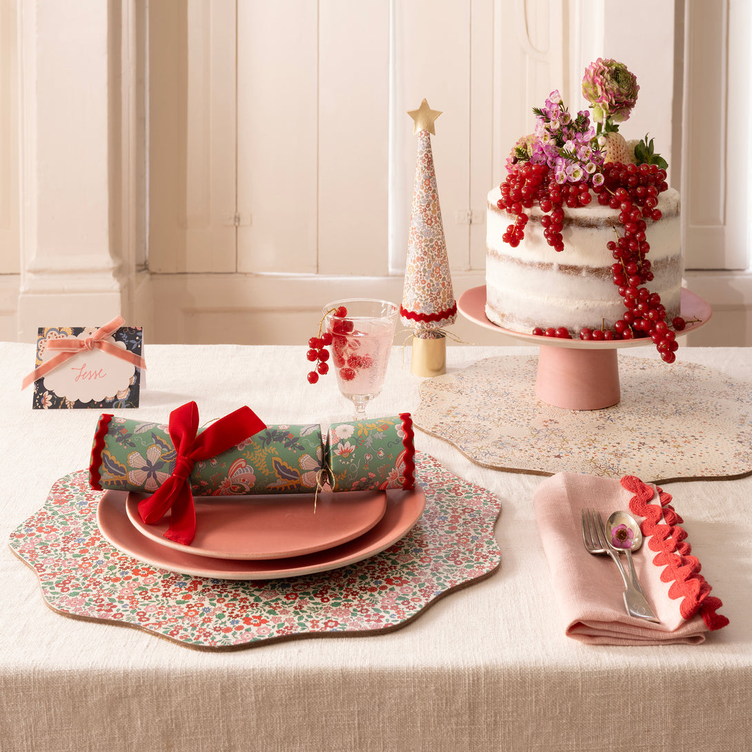 Our Christmas  place cards feature joyful Liberty prints, soft velvet bows, matt gold foil details and scalloped paper cards to write the names on. Image2