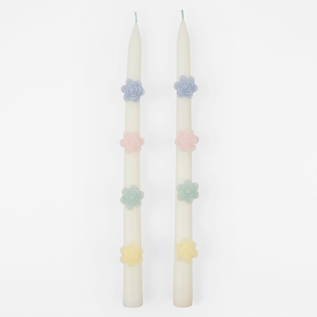 Our decorative candles are an elegant taper shape with 3D wax flowers.