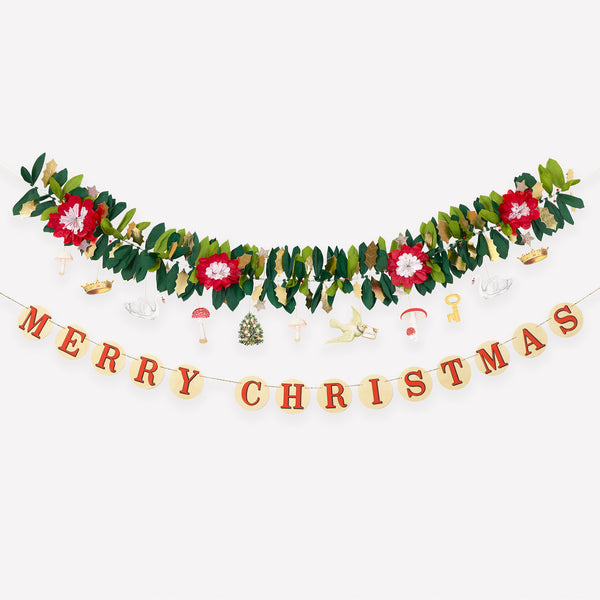 Our Christmas garlands set includes 2, one with foliage and decorative John Derian icons, the other with a Merry Christmas message. Image1