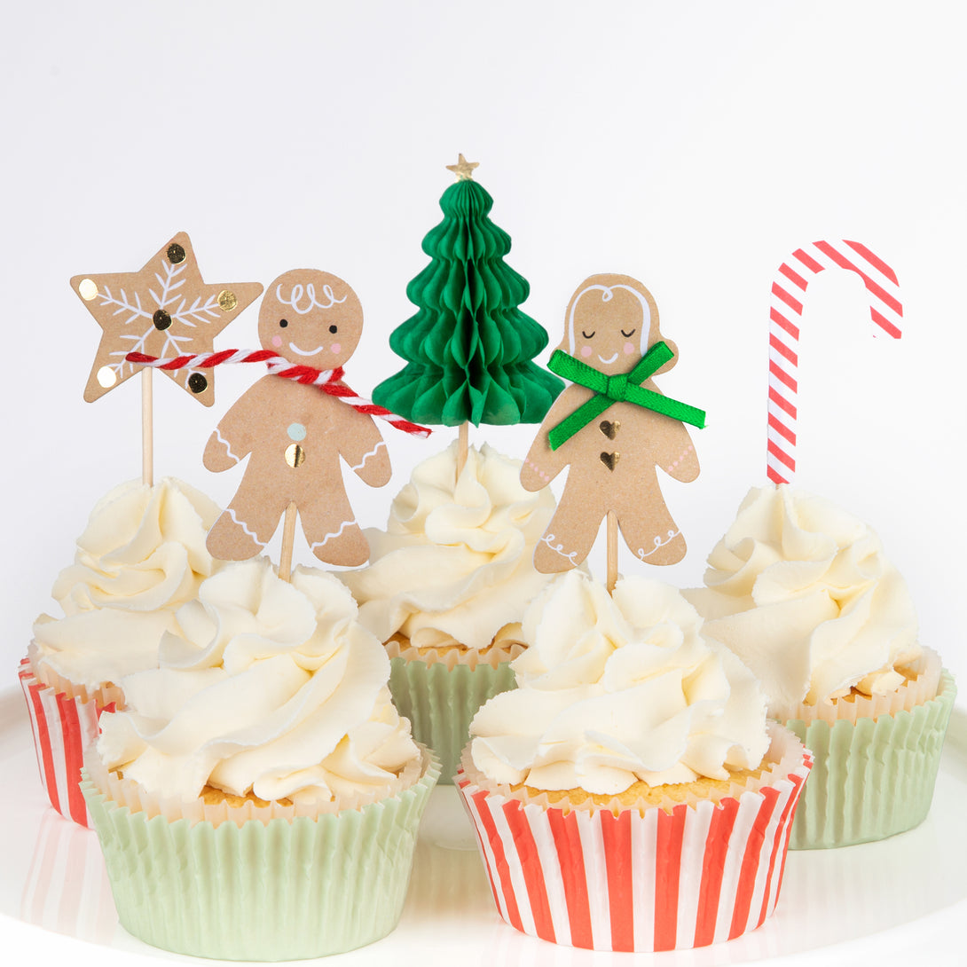 Our special Christmas cupcake kit features festive cupcake toppers and cupcake cases all packaged in a charming paper gingerbread house.