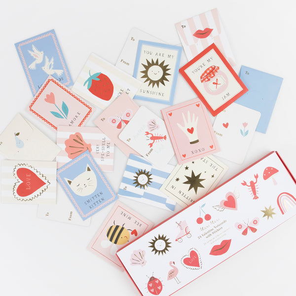 Our Valentines cards for kids include fun stickers and envelopes with puns and greetings, lots of pink and red and shiny gold foil look great.