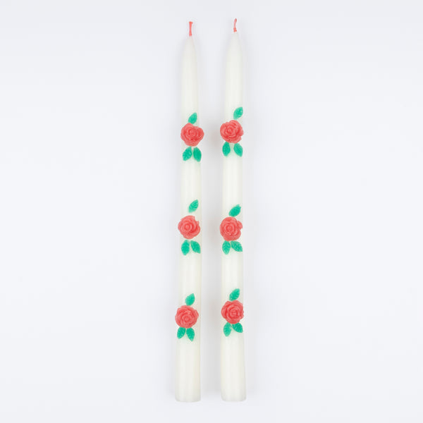 Our ivory candles have red rose embellishments and red wicks, ideal to add to your Valentine's party supplies. Image2