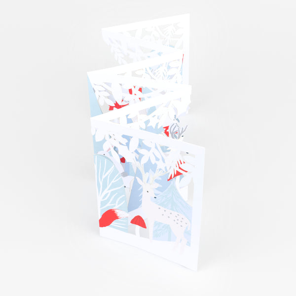 Our concertina card for Christmas opens up to show a winter woodland scene with animals, funghi and foliage, a beautiful decoration. Image1