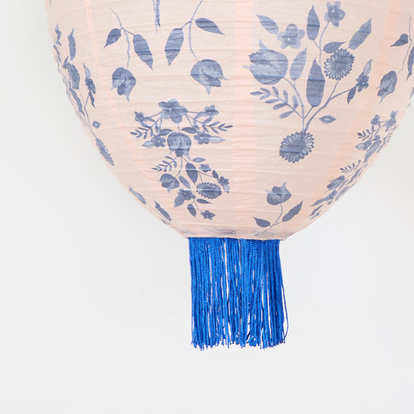 Our paper lanterns set, of three, come in mint, blue and pink, with round, wavy and oval shapes, with blue botanical illustrations and blue tassels. Image4