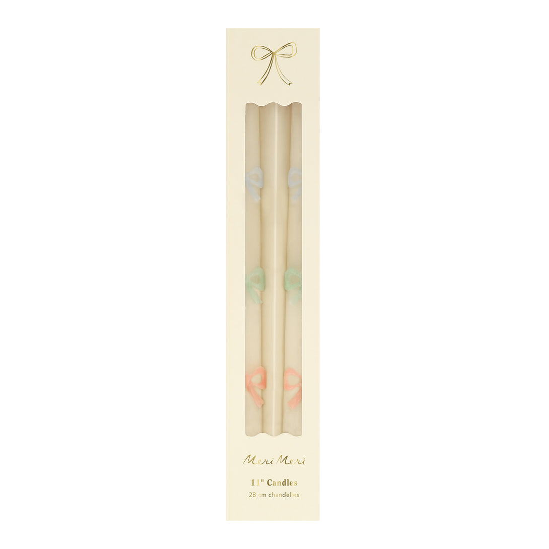 Our party candles, crafted in a tapered shape with embossed and handpainted pastel bows, have mint green wicks.