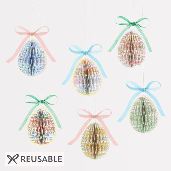 Our Easter egg decorations are made from honeycomb paper with Liberty floral designs, scalloped edges and velvet bows for luxe look. Image1