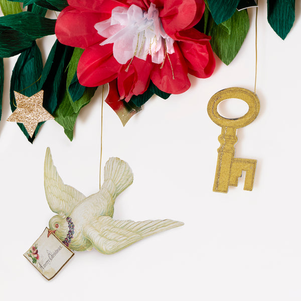 Our Christmas garlands set includes 2, one with foliage and decorative John Derian icons, the other with a Merry Christmas message. Image4