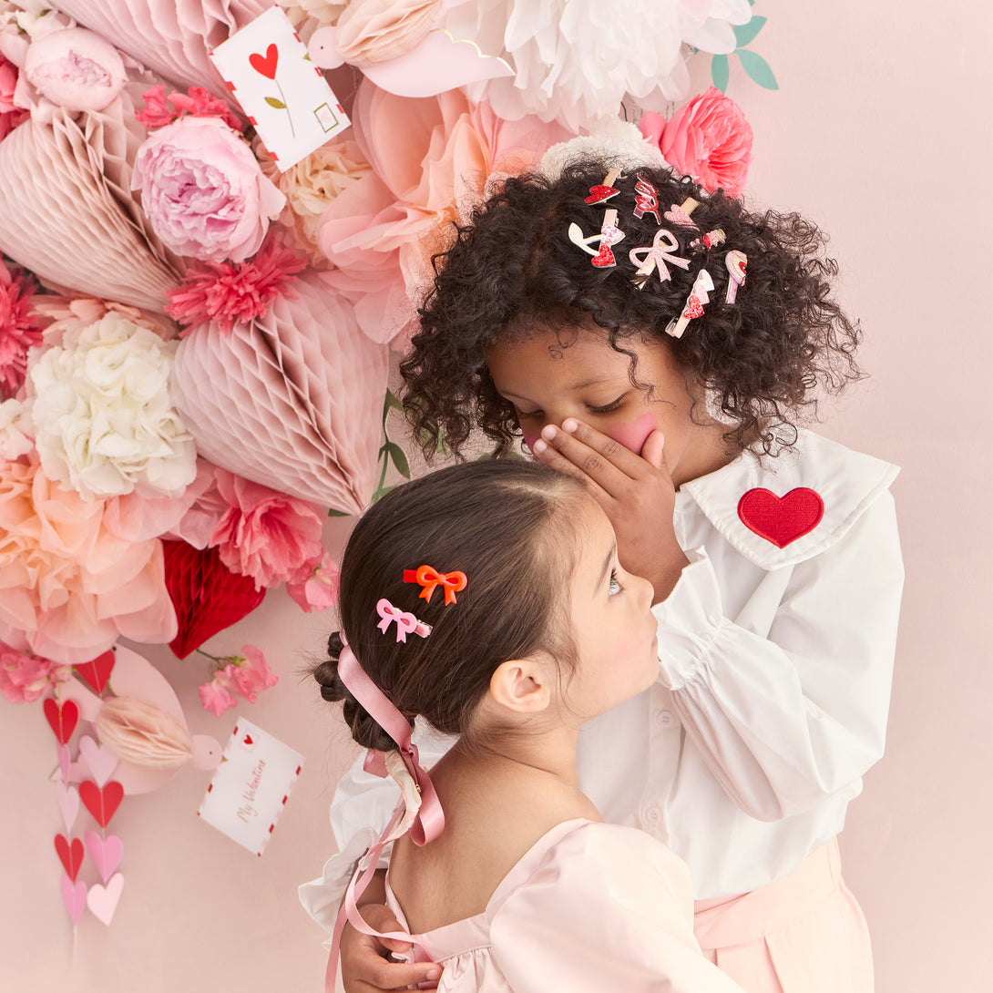 Our luxury red and pink hair clips feature enamel bows and velvet ribbons - the perfect Valentine's hair accessories for kids.