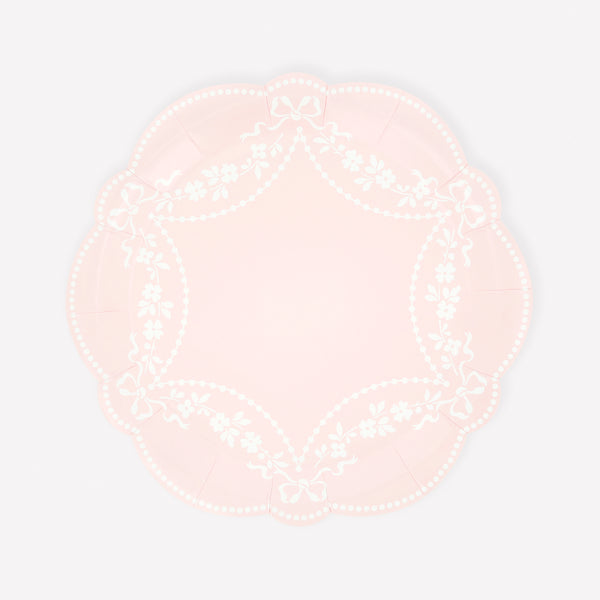 Our paper plates, in pastel pink with white ornamental designs and sculptural edges, are so elegant and sophisticated. Image1