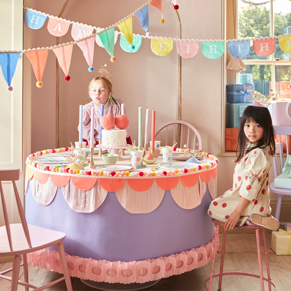 Add a pop of pastel colour to your party table or wall with our flag garland with pompoms. Image2