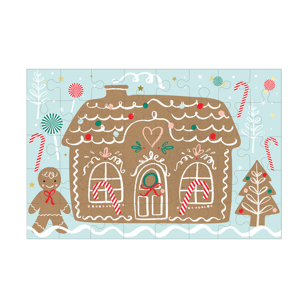 Our Christmas suitcase, in the shape of a gingerbread house, contains a colouring poster, stickers and a puzzle. Image4