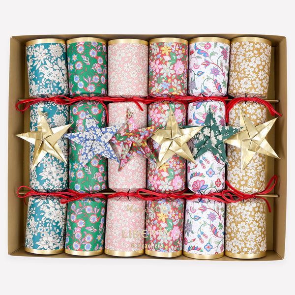 Make your Christmas dinner table look elegant with our luxury Liberty crackers with velvet bows and origami stars, containing wonderful gifts. Image1