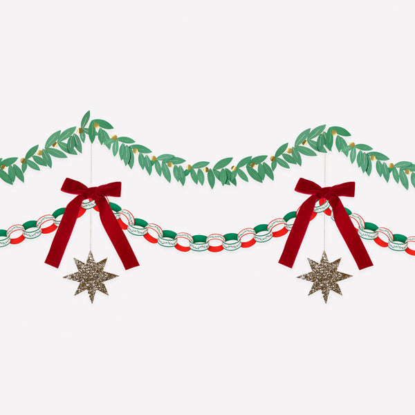 Our set of Christmas hanging decorations includes paper chain links to make a paper chain, a foliage garland and a bow and star decoration. Image1