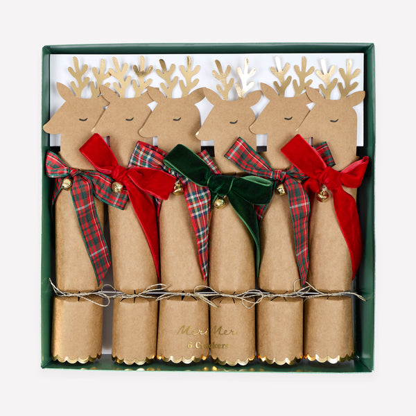 Our Christmas crackers feature reindeer with gold foil antlers and bow details in tartan and velvet, with a joke, party hat and small gift inside. Image1
