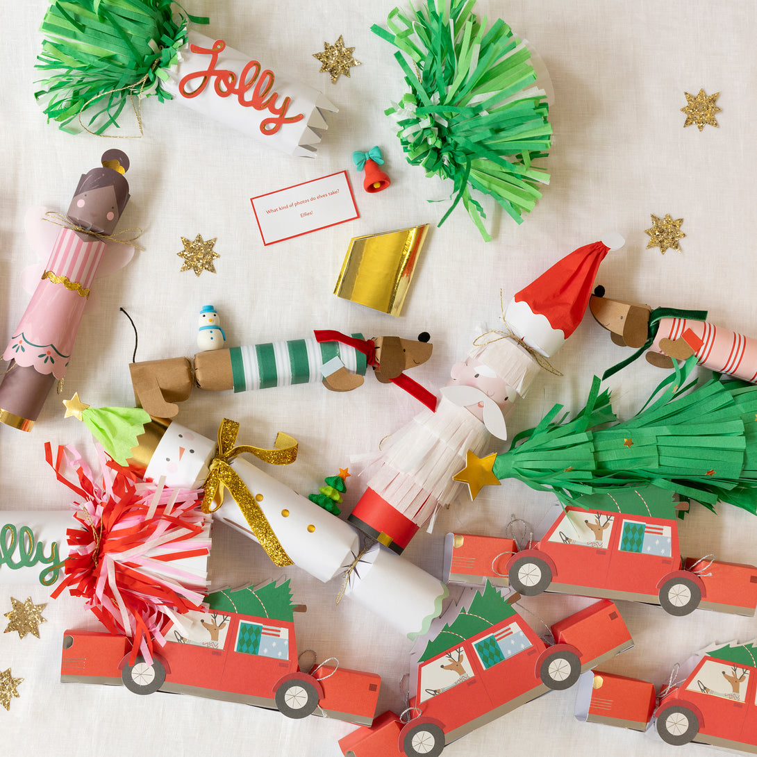 Our luxury Christmas crackers have stylish tissue paper fringe details, and contain a gold party hat, a joke and fun party gifts for all the family. Image3