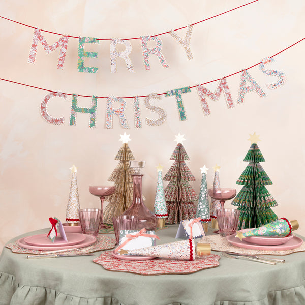 Have yourself a Meri Meri x Liberty Christmas with our sesonal set of place cards, placemats, crackers, 3D trees and a festive garland. Image2