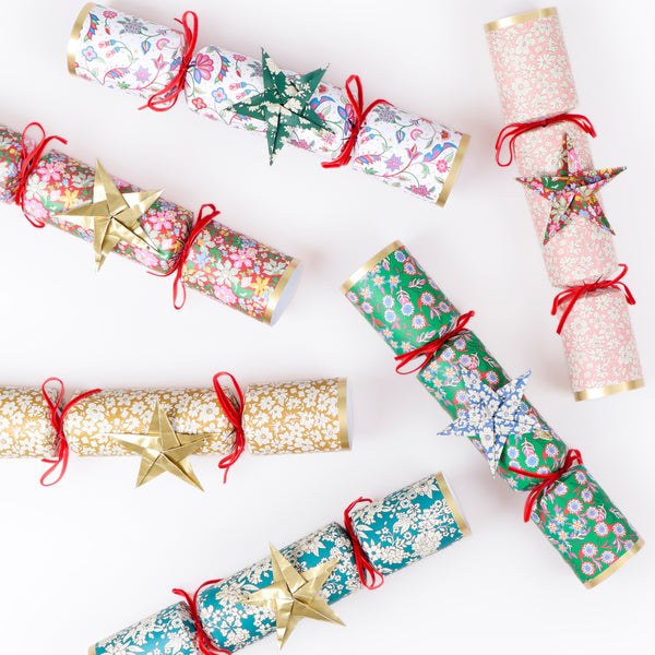Make your Christmas dinner table look elegant with our luxury Liberty crackers with velvet bows and origami stars, containing wonderful gifts. Image5
