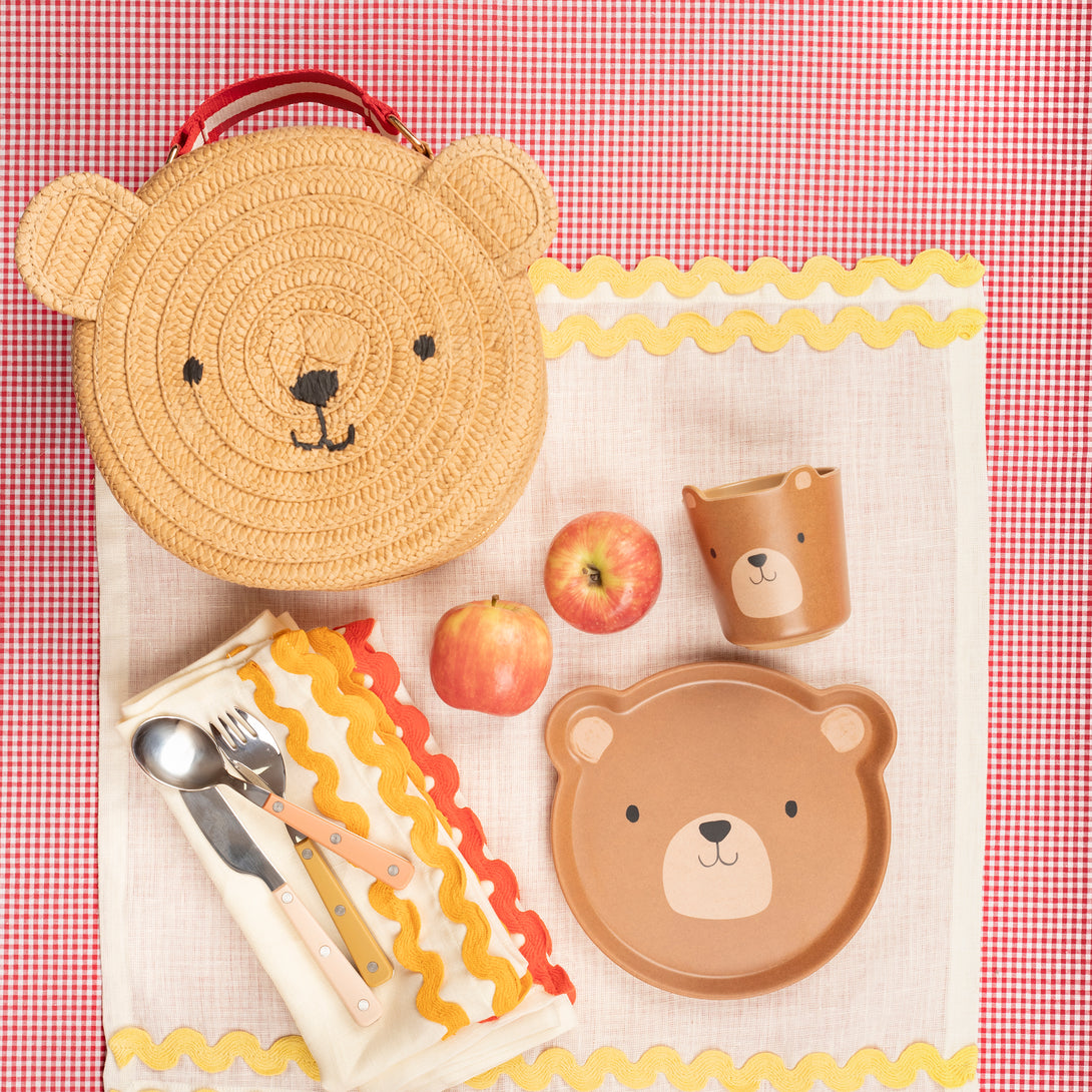 Our bear bag is crafted from sturdy paper with a fun gingham lining, perfect to wear to parties or for picnics.